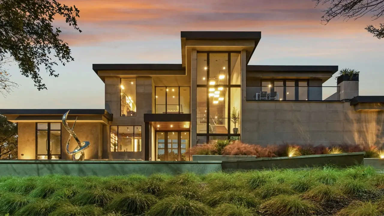 Contemporary Los Angeles home lit up at sunset
