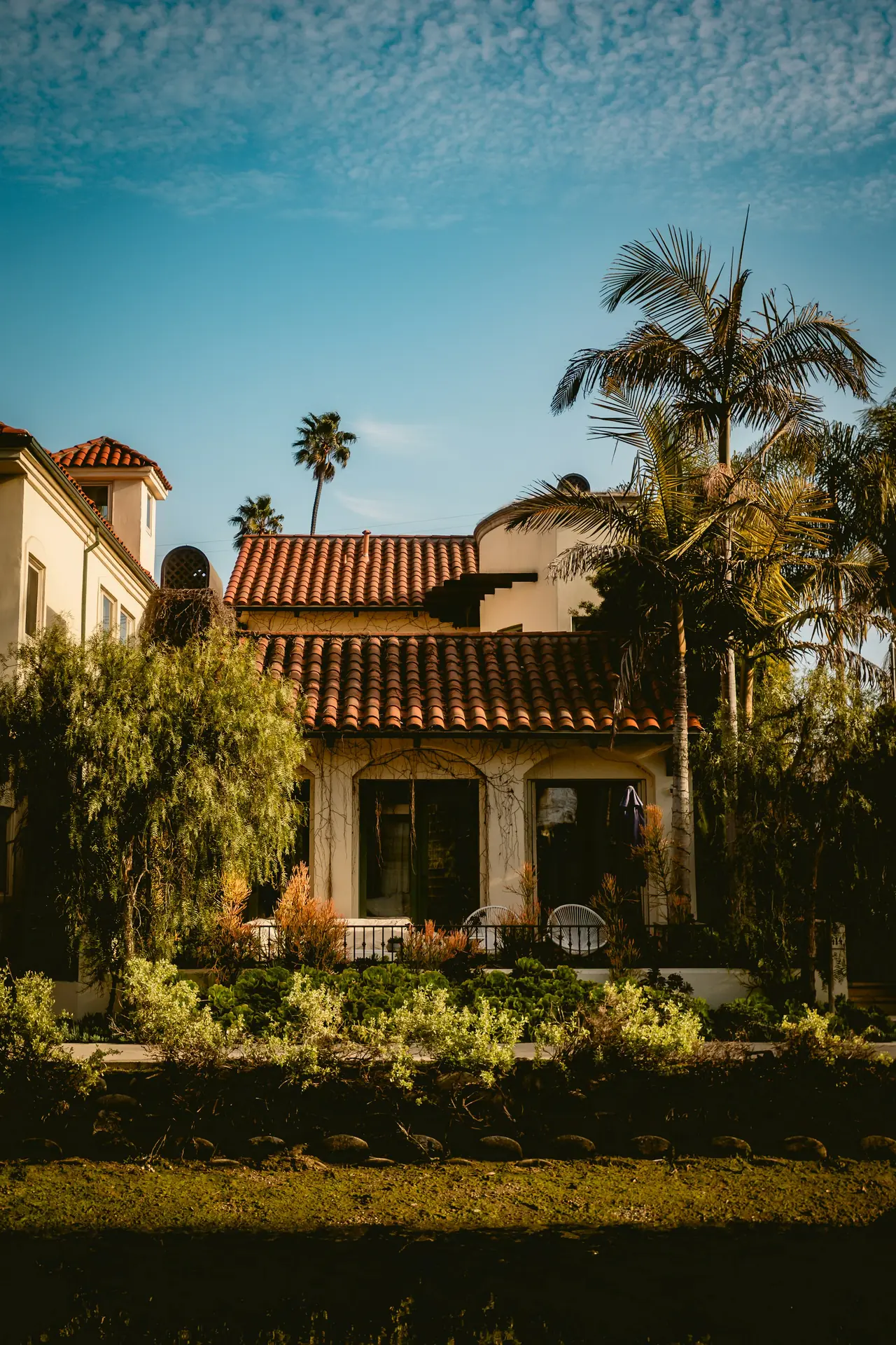 Spanish-style home with palm trees in Los Angeles